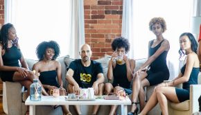 Terry Milla and FreeQuincy Girls On Couch Serious - press photo